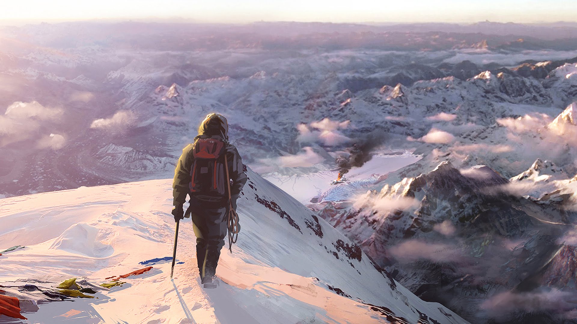 A man standing and facing snow covered mountains