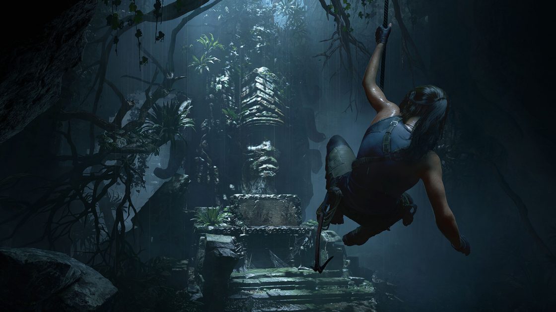 Lara croft exploring old ruin while swinging on a rope